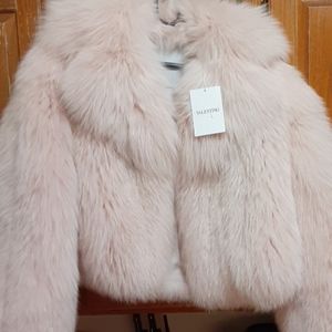 Pink Valentino fox fur coat.